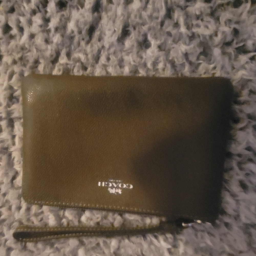 Olive colored Coach wristlet